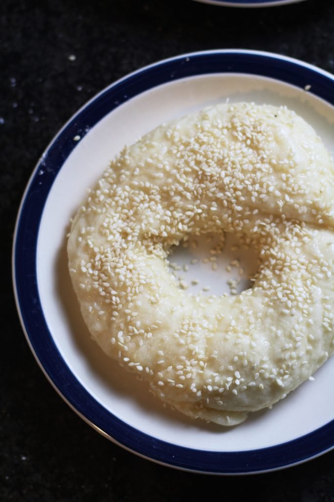 Unbaked bagel with sesame seeds