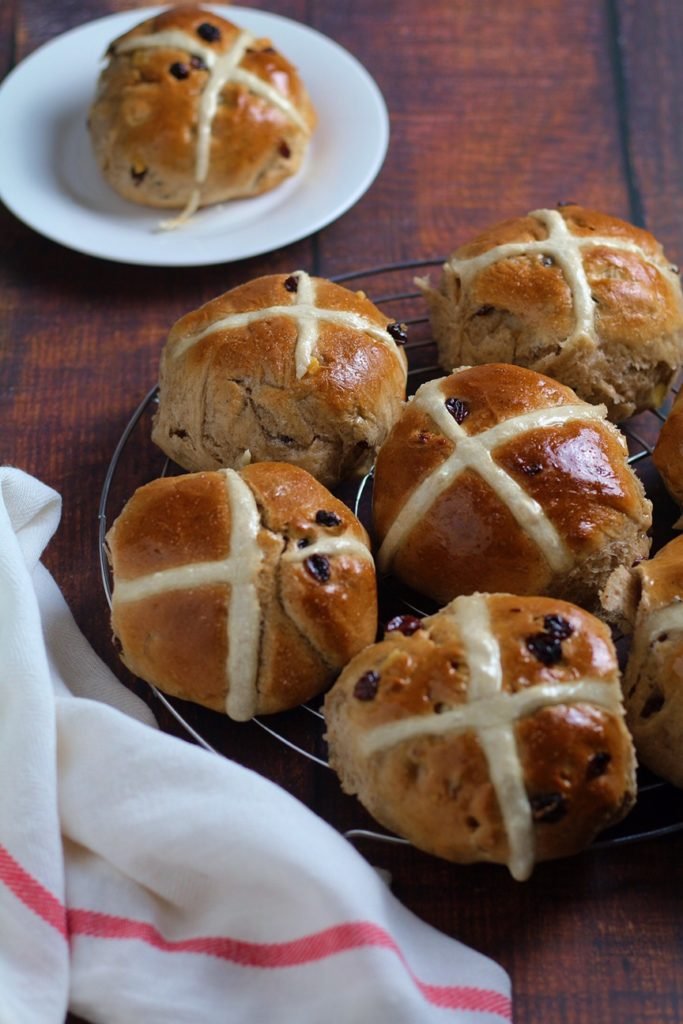 Fruity Hot Cross Buns on a cooling rack.