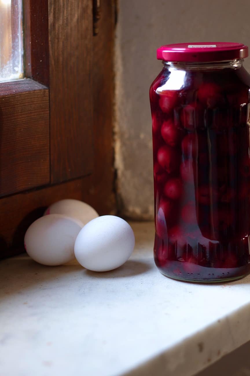 Cherries and Eggs on a windowsill.