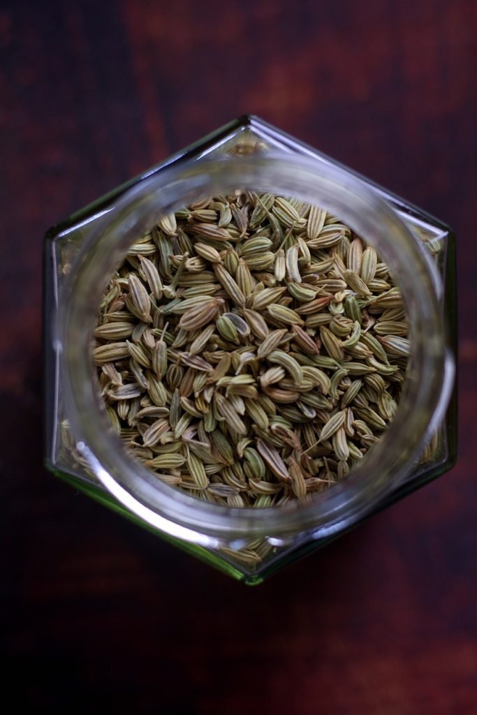 A jar of fresh green fennel seeds.