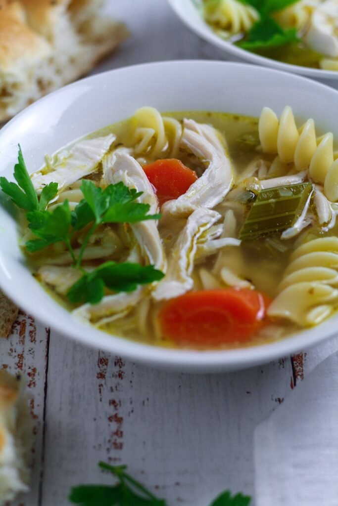 a bowl of Chicken and Noodle Soup in close-up.