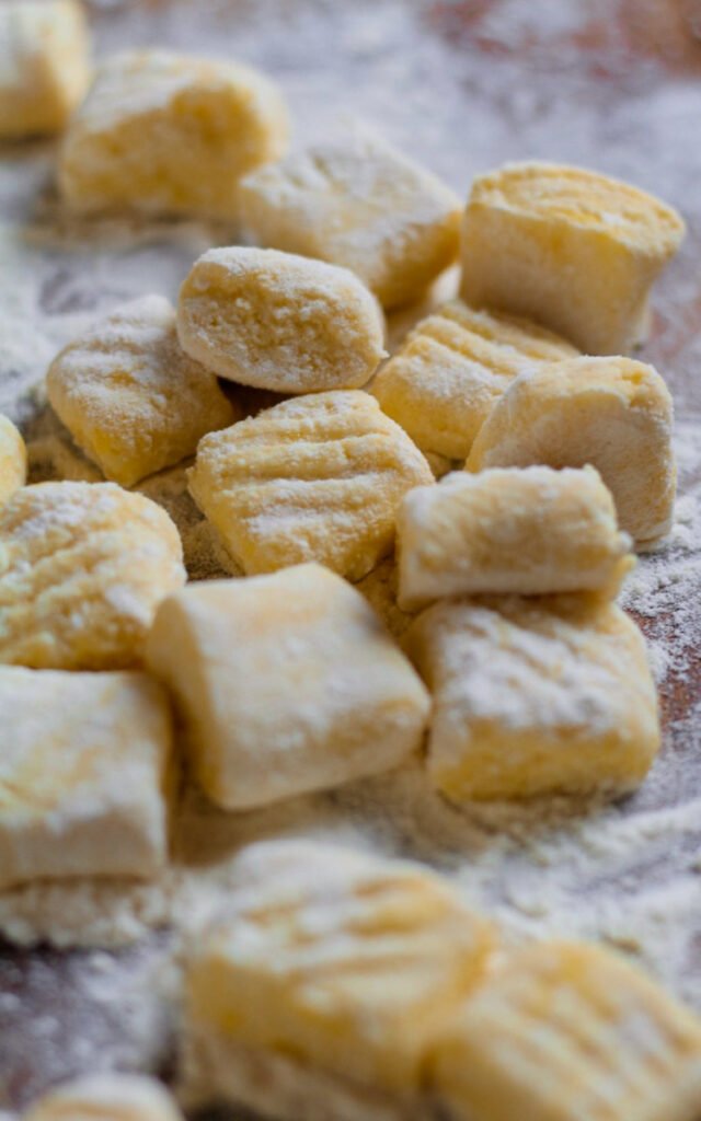A close up of uncooked ricotta gnocchi.