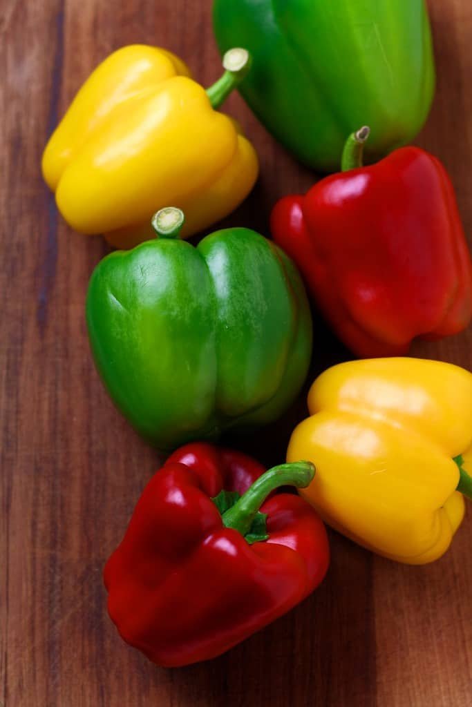 Red, green and yellow peppers.