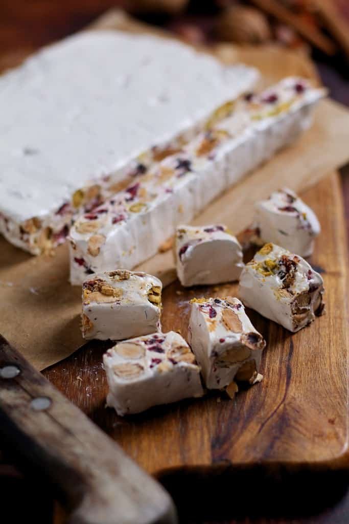 Sweet, crunchy and incredibly moreish, it is easier than you think to make homemade nougat. This recipe has no glucose or corn syrup and can be made with ordinary household ingredients. Perfect for Christmas gifts!