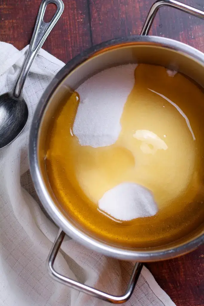 Honey and sugar in a saucepan.