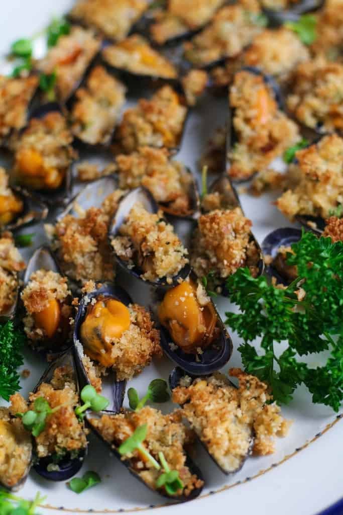 Garlic Butter Mussels au gratin or as the Italians call them Cozze al Forno are a fantastic starter or light meal for two. So quick and easy to prepare they are packed with Mediterranean flavour.