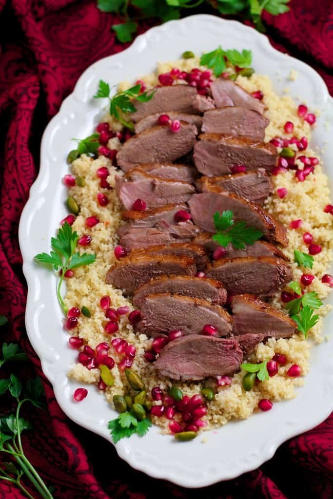 Juicy duck breast served with a sweet and sour pomegranate sauce. Seared Duck with Pomegranate is a delicious meal for two or perfect for a dinner party. Serve with jewelled couscous for a showstopper dinner.