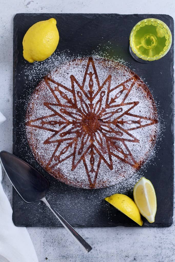 Torta Caprese al Limone is an Italian cake with a mouthwatering combination of almonds, lemon and white chocolate with a soft and fudgy interior. This gluten-free treat is ideal for enjoying after dinner with a glass of limoncello.