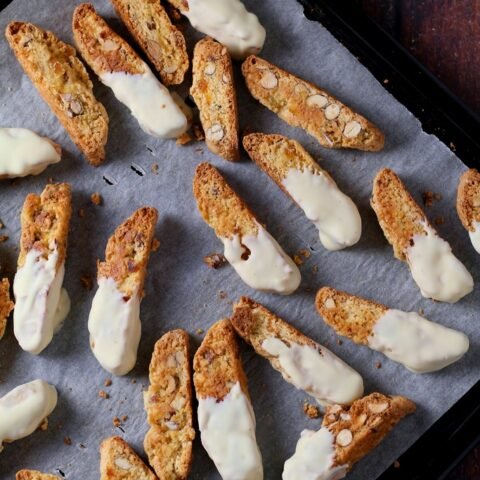 A tray of white chocolate dipped Apricot and Almond Biscotti cookies.