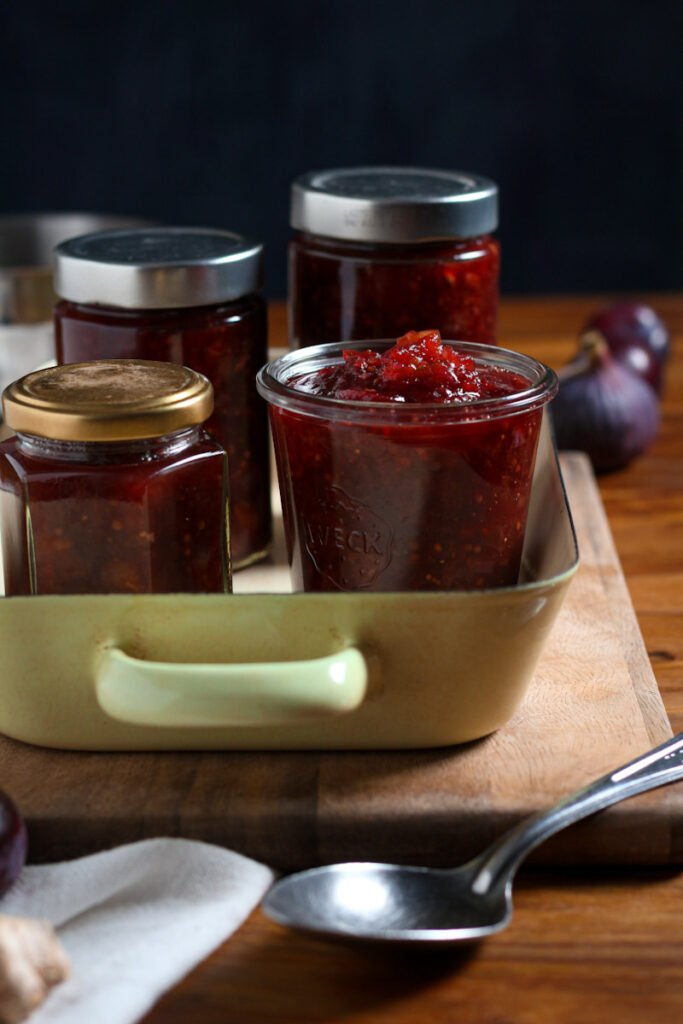 A photo of jars of sweet fruit chutney ready to be sealed.