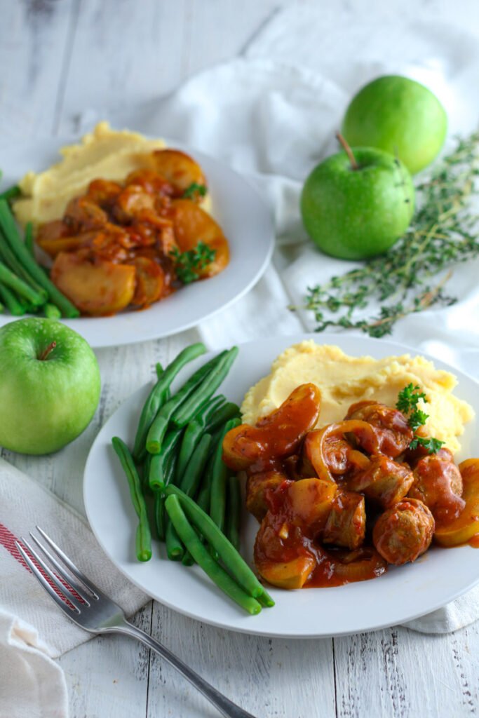 Devilled Sausages on a plate with beans and mash.