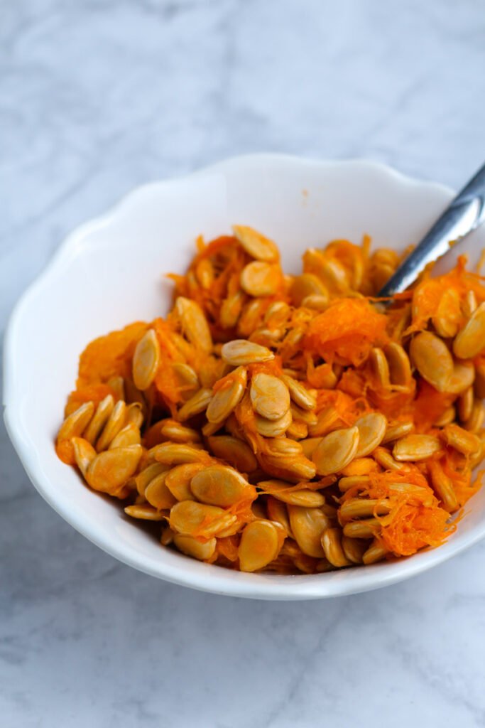 A bowl of pumpkin seeds.