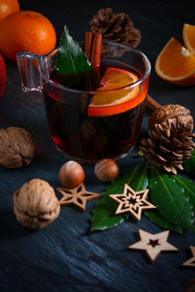 A mug of Glühwein with spices and citrus..
