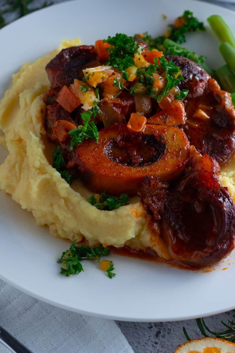 Beef Shank Osso Buco with Blood Orange Gremolata and mashed potatoes.