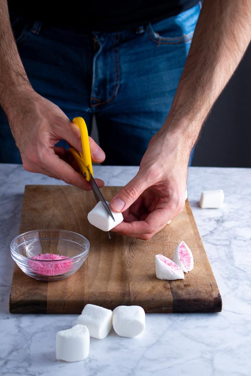 Cutting marshmallows for Easter Bunny Cupcakes