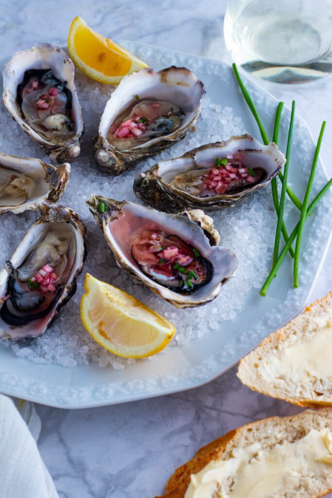 Fresh Oysters with Shallot Vinaigrette are truly one of life’s little luxuries. The contrast of creamy, briny oyster flesh with a tangy vinaigrette is a match made in culinary heaven and one I find completely irresistible.