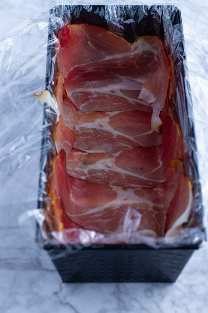 Loaf pan lined with prosciutto