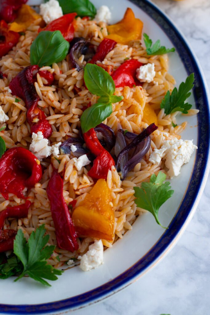 Packed with roasted peppers, tangy feta, fresh herbs and chewy orzo, this bright and beautiful pasta salad is a summer favourite. Orzo and Roast Pepper Salad gets better as the days go by, so make a big batch to take you through the week!