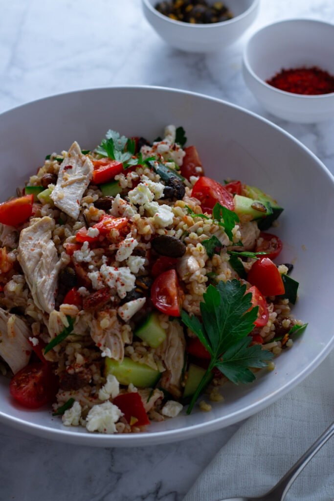 Chicken and Farro Salad with tomatoes, cucumber, peppers and feta.