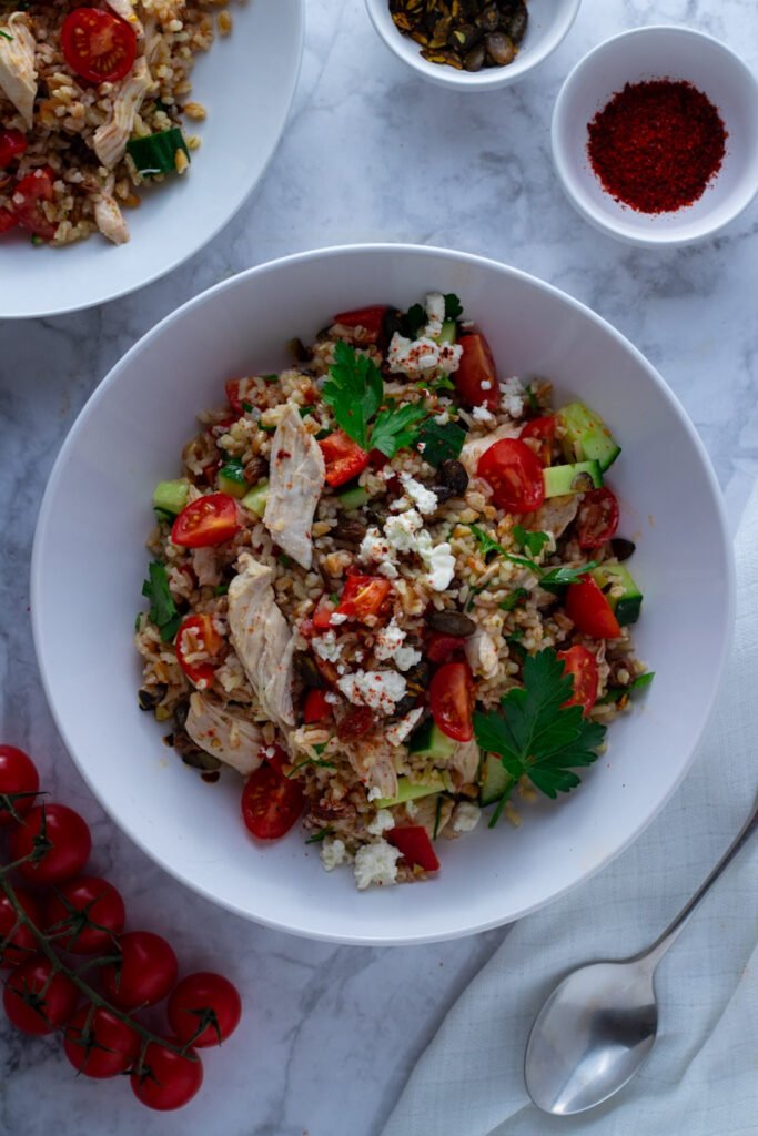 Chicken and Farro Salad is hands down one of my favourite lean and green chicken recipes! Packed with nutritious grains, lean poached chicken and fresh vegetables, this super salad is healthy and incredibly delicious too!