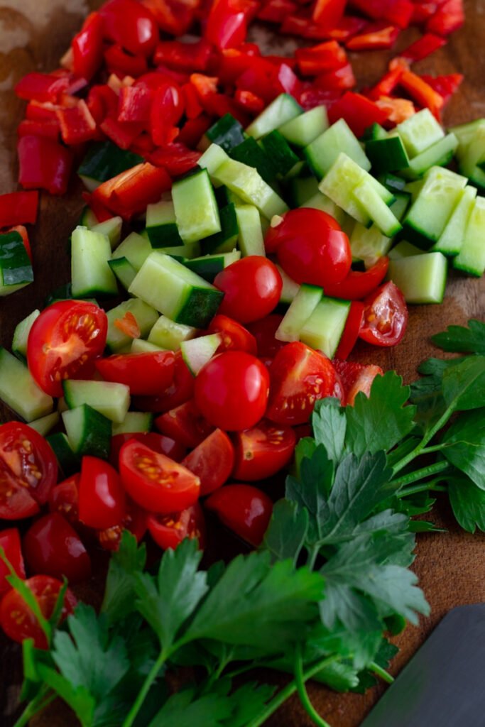 Diced peppers, cucumber, cherry tomatoes and parsely