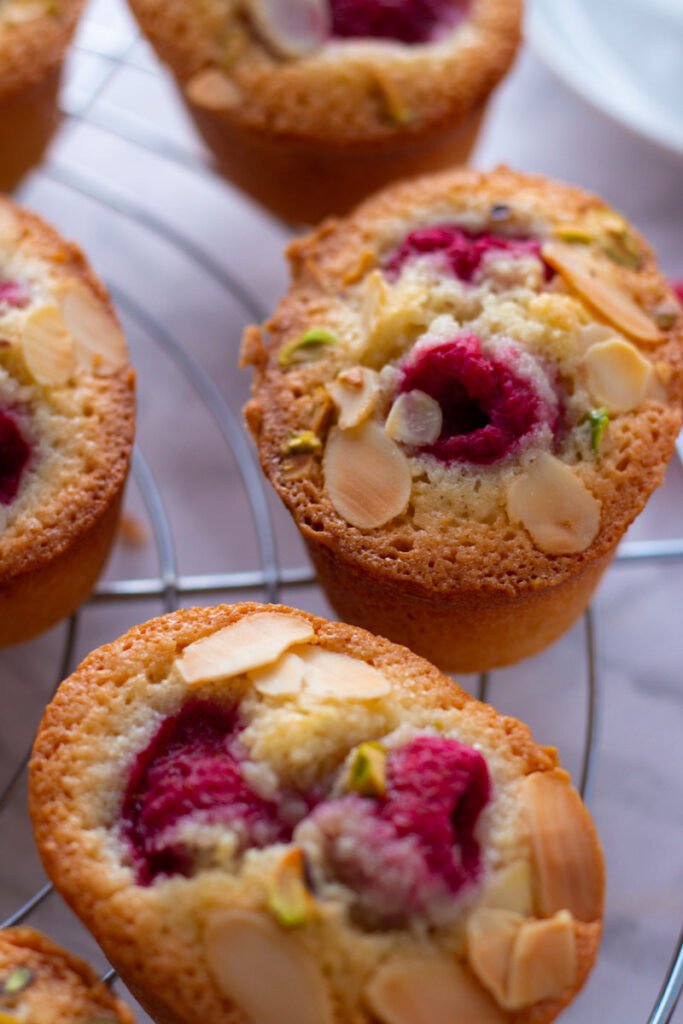 Raspberry and Almond Friands on a wire rack