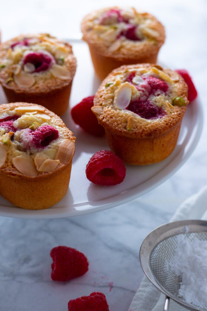 Raspberry and Almond Friands on a cake stand