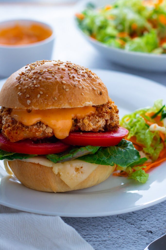 Spicy Crumbed Chicken Burgers serves with homemade coleslaw and fresh corn