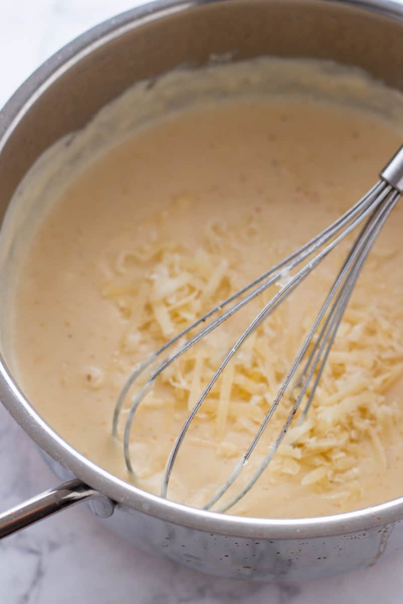 Bechamel sauce with cheese in a saucepan