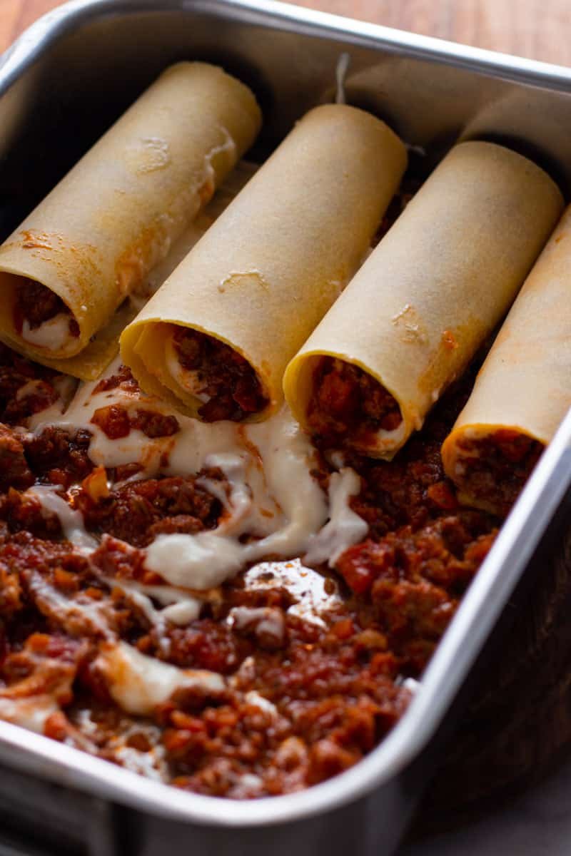 Rolled Tubes of cannelloni stuffed with beef ragu