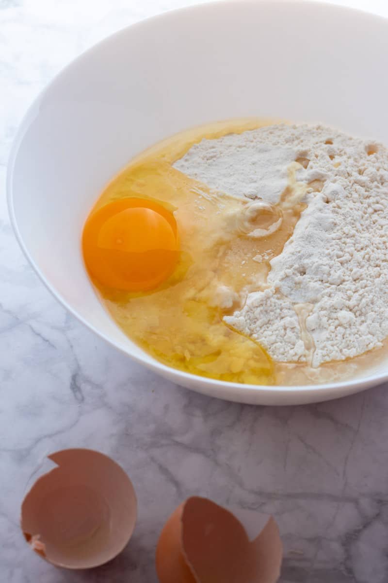 Eggs and flour in a bowl for homemade strudel dough