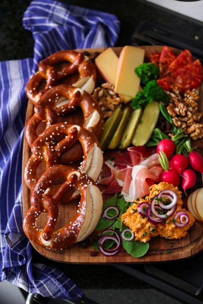 A brotzeitteller with pretzels, meats, cheeses and Obatzda.