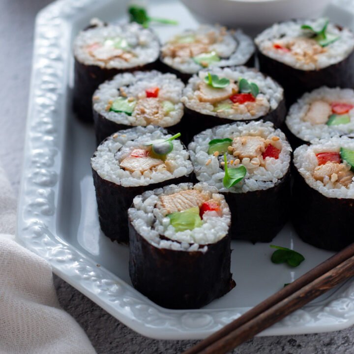 Easy Teriyaki Chicken Sushi with pickled ginger on a serving plate.
