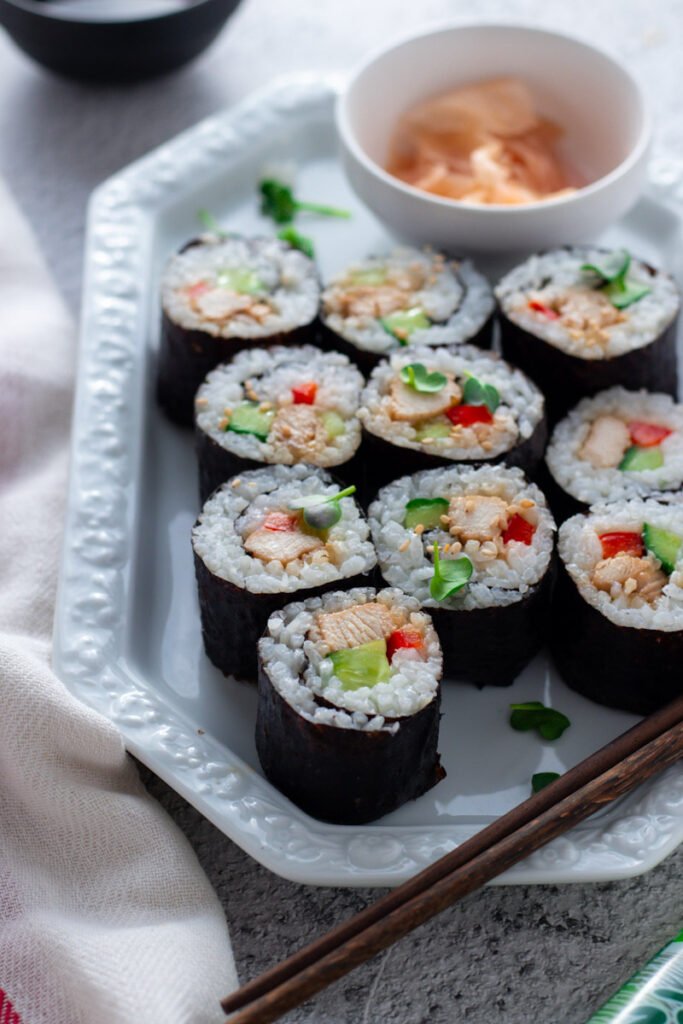 Easy Teriyaki Chicken Sushi with pickled ginger and soy sauce.