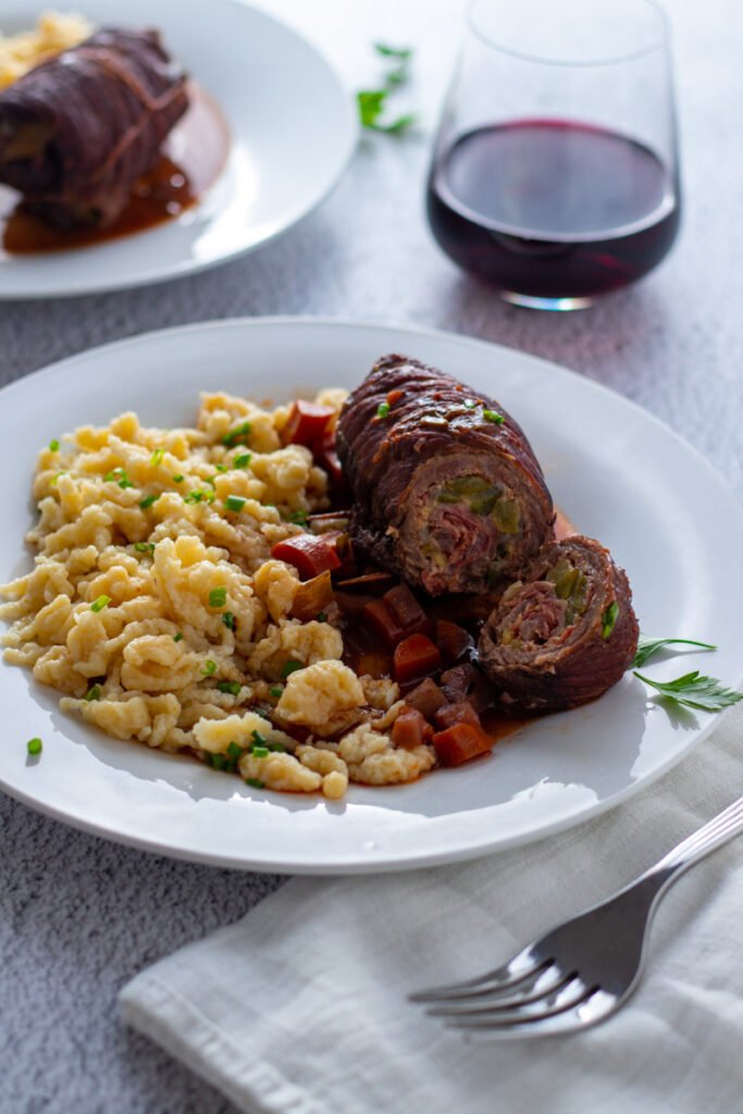 German beef rouladen with spaetzle and red wine.
