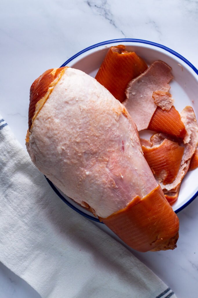 Ham with skin removed showing fat layer.