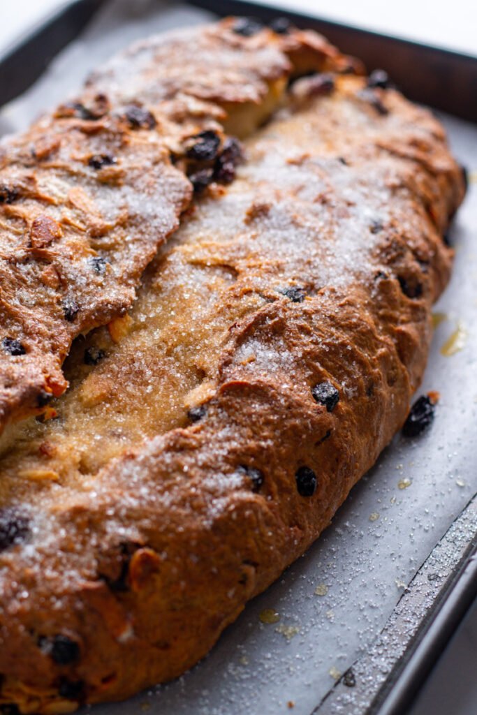 Freshly baked Stollen on a baking tray.