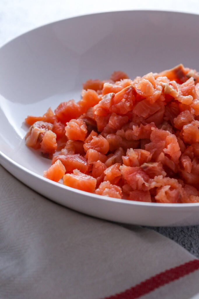 Diced salmon in a bowl.