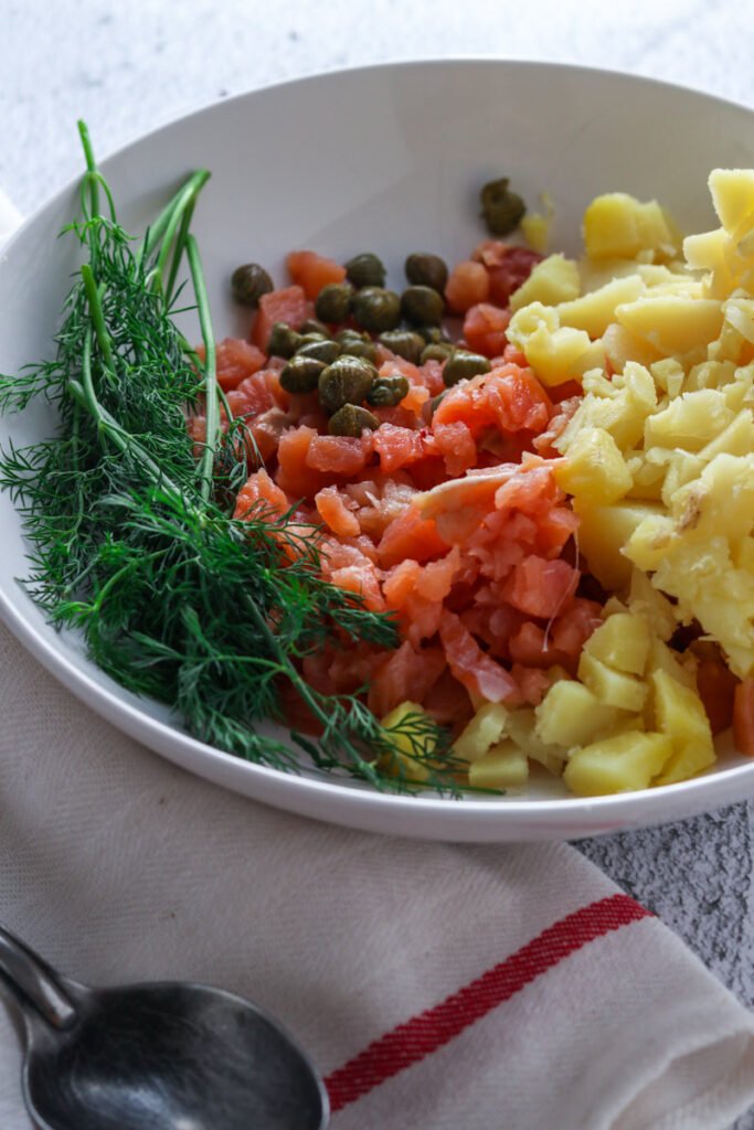 Salmon, dill and potato in a bowl.