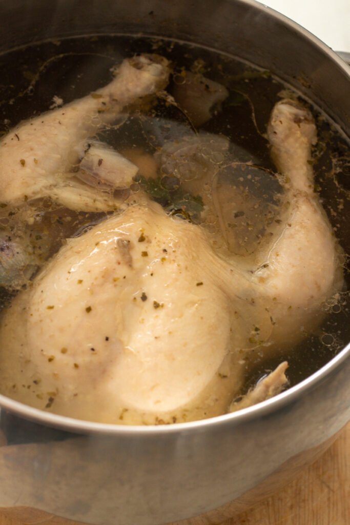 Poached Chicken in a pot.