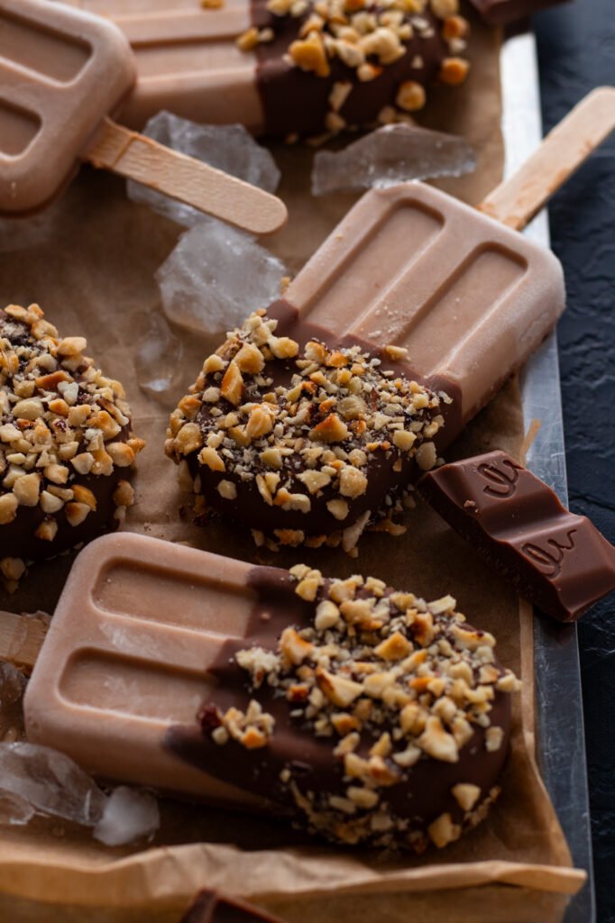 Homemade Chocolate Popsicles on a tray.