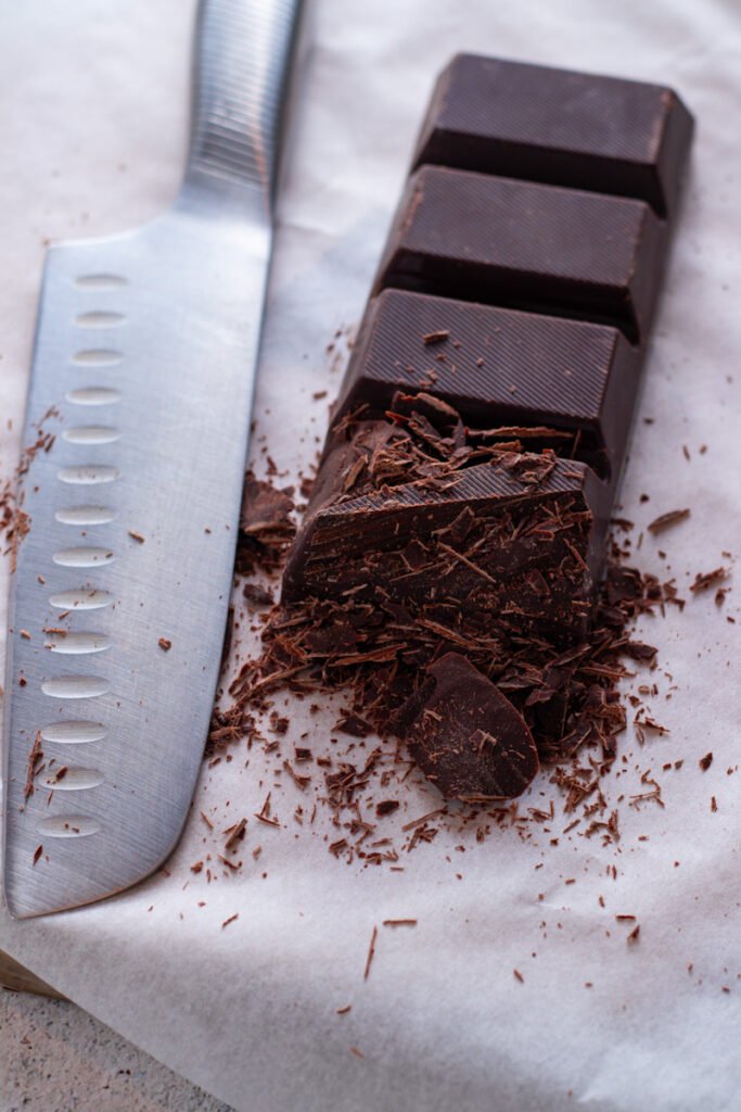 Chocolate couverture and a chef's knife.