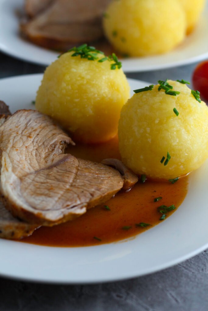 German Potato Dumplings with roast pork on the side.