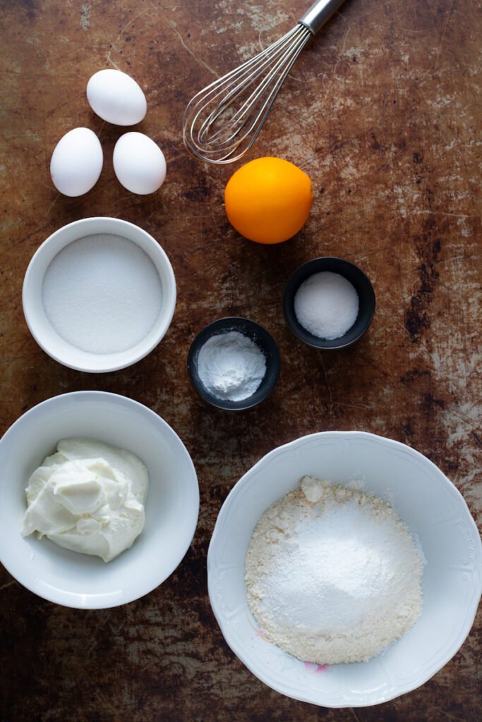 Ingredients for Quarkbällchen Donut Holes. Eggs, orange,sugar, quark, flour, baking powder, vanilla sugar.