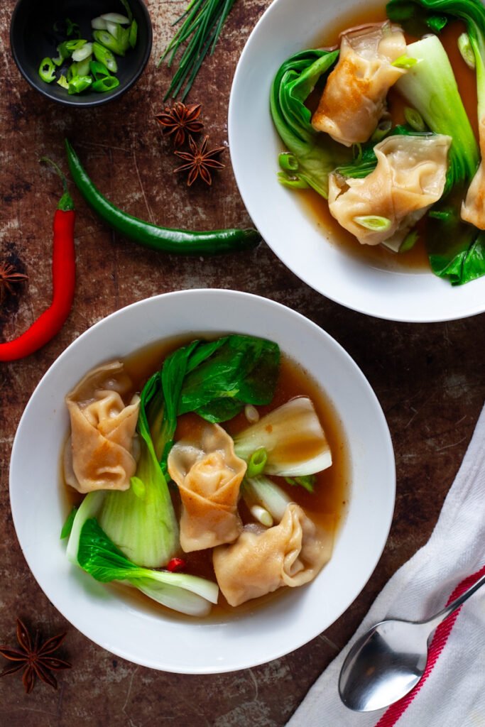 Bowls of Chicken Wonton Soup seen from above.