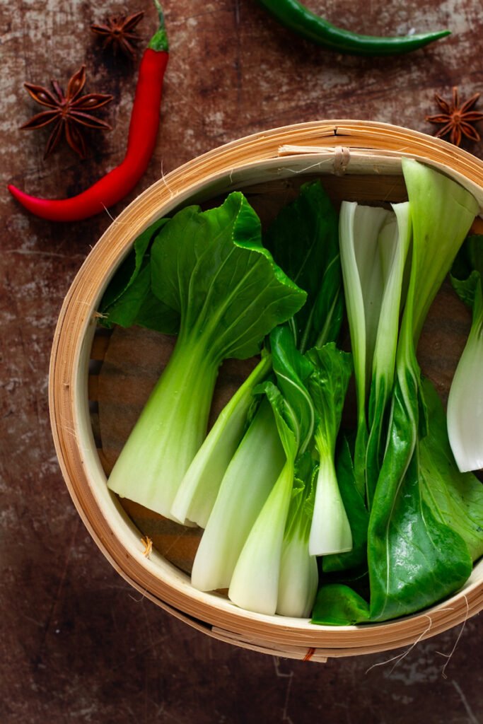 Bokchoy in a bamboo steaming basket.