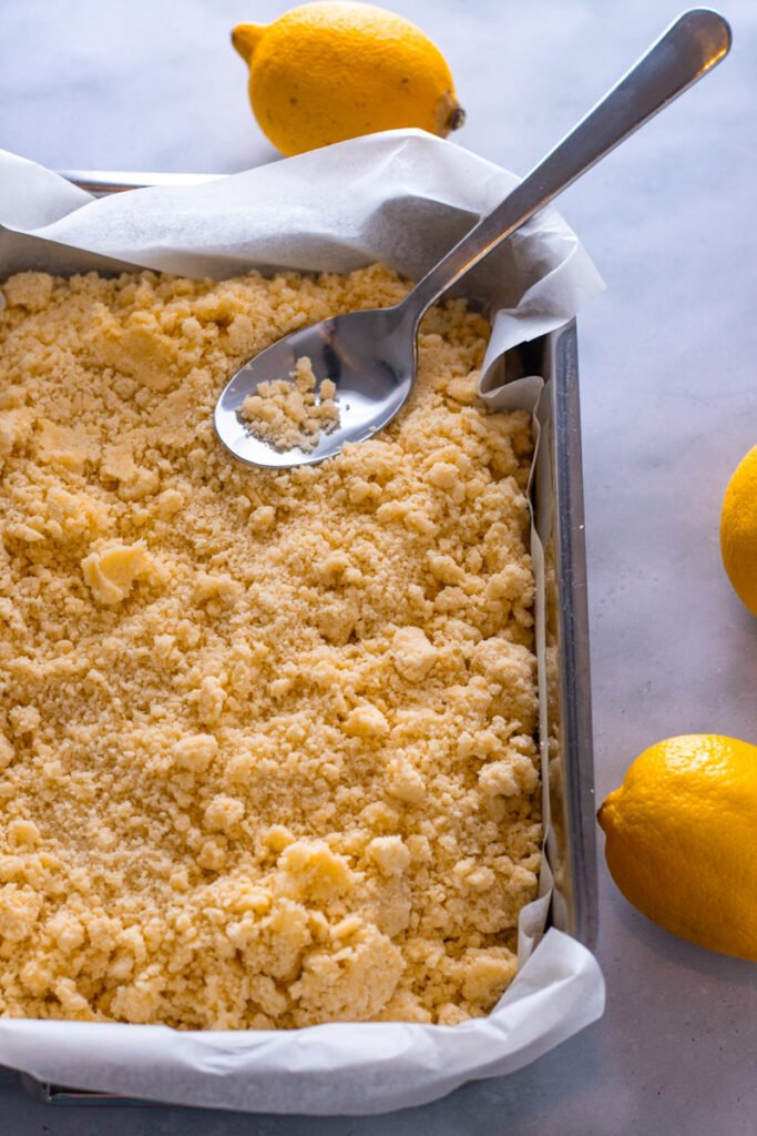 Crumbly Shortbread Dough in a baking dish.